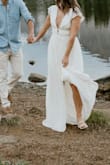 This dress was exactly what I was looking for to take engagement photos. Definitely runs long (I'm 5'3"), so I should have tailored it, but it worked fine for the shoot. If I were to wear for a formal event, it would definitely need to be taken up by a few inches (even with heels), but that's pretty standard at my height. I had ordered in both XS and S, and the XS was definitely too tight around the waist and butt (there's a more fitted liner), but the S could have been just a bit tighter on the bust and sleeves, which do have little rubber pieces to help keep them up. Overall, it worked great, and I got a ton of compliments! - Blayke R.