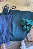 I ordered the emerald color for a wedding that I'm in and although it looked a dark green in the photo, it was more a turquoise color in person. Unfortunately, I had to return for this reason. 

The photo has a truly green and true blue color for comparison - Kaylie M.