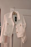 I'd have returned it but I bought it final sale. It looked good in the photos but it's made of this stiff, spongy material that has no drape so the jacket has an unnatural fit. It also wrinkles easily and very noticeably. I'll never wear it. Waste of money. - Catherine K.