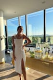 Wore for my engagement party and received so many compliments! Felt like a princess in this dress. Did not require any alterations and was true to size! I love that it was double lined so I didnt have to worry too much about undergarments showing through. So comfy, stretchy and lightweight-- obsessed with this dress! - Allison K.