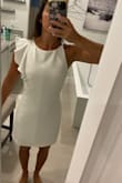 I don't know why I waited so long to order this dress, but I love it. I feel like lately I'm between a small and xs in lulus dresses, but this xs fits perfectly. It's maybe a tad short for work but I'm wearing it anyway. It falls about mid thigh. - Caroline M.