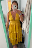 I absolutely loved this dress. It fit great everywhere, but the chest area/shoulder straps were just a little too loose. It would have been too small if I sized down but I don't know that getting it tailored would have fixed the chest area, so ultimately I ended up returning. - Aubrey S.