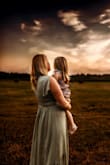 I recently purchased this dress for family photos. I had a baby in May, so it was difficult to find a dress that would fit my postpartum figure and this dress worked perfectly. I had trouble with the zipper - it was tricky and I definitely needed help zipping it up. - Whitney S.