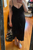 This dress is very pretty. I've only tried it on so far, but it fit great. The material around the bust area is a little thicker than the rest of the dress and DEFINITELY holds you in. - Brittany A.