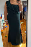 This dress is gorgeous. It has stretch but it's thick so you can't see lumps/bumps lol. I haven't worn it to my event yet so I don't have photos but it fits really nice and the trumpet flare gives you an hourglass shape. Highly recommend! - Jessica B.