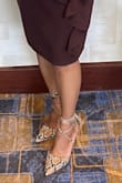 These snake skin pattern shoes look amazing. Heels are not too high and the tie-ups are a bonus with a gold tip. I received so many compliments from both men and women! I'm happy I bought them! - Michele D.