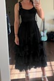 This dress was so gorgeous!! Pictures don't really do it justice because they don't show how the tulle moves at the bottom. It's not too poofy either. My only complaint is that the sleeve ties are very thin lace, so I would probably sew some reinforcement to it before wearing it as it seems like it could tear easily. - Anna L.