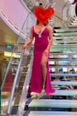 I ordered a Small and it fits perfectly! The material is stretchy so I was able to fit my curves just right! It's a long dress but I wore high heels so it was fine to walk around just pick up the bottom if you're going upstairs. The color is so bright and a beautiful magenta. Be prepared for a lot of compliments, I wore mine on a cruise last week for a formal night. It's a very low cut on the front. I am a full C (34C) thanks to my doctor lol. I will definitely wear this again a couple more times because it was comfortable for me and flattering! I felt like a Barbie Girl! Lol! - Sherrylann F.