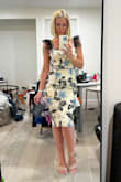 This dress fit like a glove, has enough stretch to move with you. Received many compliments. I'm only 5'1 & I liked that it covered my knees. - Carla R.