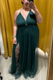 I'm usually a 2x and this dress fits almost perfectly! It did run a little big but not big enough to size down, so my back looked and felt great. I did have it altered to my height, closed the slits up a little, and brought in the bust area just for added support. - Sydney O.