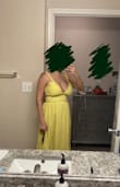 The dress fit true to size, however, I should've ordered one size up because I am usually between a Medium and a Large. No stretch in the waist and it was a bit tight. Definitely a flattering cut for a postpartum mom's belly as it glides away from your waist but cleavage was too much for me. Not breastfeeding friendly - I was hoping to be able to slip the strap off my shoulder but the tie on the back holds the strap too tight. Great dress otherwise, if I was in a different season of life. - Brittany R.