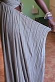 I bought this dress for a vacation trip. I normally wear a small but thought I'd give a medium a try so it would be flowy. I wore it for 3 hours when the elastic waistband just gave way and my [bottom] was hanging out. Now, I can't return it since I took the tags off to wear it. - Cheryl C.