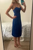 I love this dress! I wore it to a wedding and was comfortable all night. Thankfully the straps didn't loosen at all. I went back and forth on size based on the reviews, and I was happy I ended up going with an x-small because my rib cage is pretty small. I would have definitely needed the small otherwise. I didn't have the issue with the bunchy zipper as some people commented on, but I also don't "fill out" the back very well. - Madison K.