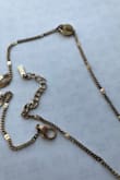 Really loved this necklace set but it tarnished after wearing it 3-4 times (took it off when showering). I wish the site was more specific about what material it's made out of. - Maria J.