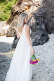 I bought this dress for a beach elopement and it worked out perfectly! Per the size estimator, I was a medium but ordered both sizes. The medium was way too big, small fit perfectly. So maybe size down if you use their estimator! I loved the detailing and cut of this dress. - Courtney B.