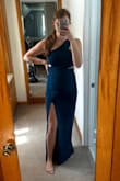 I bought this dress for a wedding in September. The material is thick and of excellent quality. The color is rich and beautiful. The material also stretches as needed and fits me well despite being 15 weeks pregnant. - Megan B.
