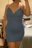 The material has some stretch but the silhouette in the bust is not attractive nor is the back. My breasts do not feel supported and using sticky bras or tape does not work well. I tried the Bombas inserts and it doesn't work with this dress either. My waist and hips in the front as well as my profile and are cute. The back has some extra material that I can not get cinched when I pull and tie the strings. Thought about double-sided tape but honestly, it doesn't seem worth it, and I would really have to Macgyver it. I bought it on sale and I can't return or exchange it, so maybe I'll find some way to make this dress work. - Macy M.