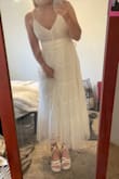 I wore this dress to my bridal shower and in my engagement pics. It fits perfectly on my size 6-8 body and falls just above my ankles (I'm 5'7"). It's super flowy and nice quality! The material is a little see-through at the top so you might want to wear pasties! - Danielle B.