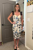 This dress fit like a glove and in person it is beautiful! It is very well made with a lot of detail and the ruffle shoulder gives it some edge. Love it! - Kelly N.