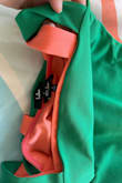I ordered this in green and coral, both in size small. The green fits great and I like the spacing of the straps on it (matches what I expected from the model's photo on the site). The coral on the other hand in the same size has straps way closer together for a look I don't really like and is a bit tighter overall. The photo shows the difference in the placement of the straps on the green vs coral despite the same size. The fit rating I chose is for the green so for the coral I would say runs small and would get a bigger size if I could. I ordered these on sale with no return option so the coral is just a sunk cost. Also the green is a Kelly green rather than more of an aqua like I thought from the pic of the model. - Katarzyna K.