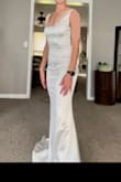 The material of this dress is PERFECT. Shiny, but stretchy and comfy. I loved how I felt in this. Great quality and seems more expensive than it is. - Shelby J.
