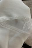 The item came with two holes in the lace cutouts on the side and a few pulls in the sleeves. - Sara K.