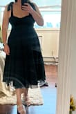 This dress is beautiful! The color is perfect for a fall wedding guest dress and the dress flows really nicely because of a hidden band at the bottom that helps it keep that bouncy/flowy shape. My only difficulty is with getting the ties/bow even but with some help it's possible! - Abby T.