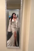 This dress is lovely. It fits my body wonderfully and I think it would work with or without a bra. The only things I would change is 1) the slit. I will be getting the slit sewn a bit so that my entire thigh isn't out. 2) I will also be adding a bustle so I can walk around freely. 3) I will be sewing the inner lining to the outside lace so that it doesn't show. These are all very easily fixed solutions! I will say the arms a little snug so if you have bigger arms take that into consideration. I cannot lift my arms all the way above my head in this dress. - Mary B.