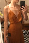 Beautiful. It fit around the waist and hips well, but is too baggy on a flat chest. - Laura