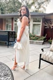 This dress is stunning! Very good quality, not see-through. The bow fastens securely and is a bit heavy but not uncomfortable. I wore it for my engagement party! Highly recommend! I'm about 136 lbs and a medium fit a bit snug but looked amazing! - Marianne S.