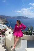 The Hot-Pink Ruffle Dress became my vacation highlight in Santorini. Its vivid hue perfectly matched the island's charm, and the ruffle details added a playful elegance that caught everyone's eye. Lightweight and comfortable, it flowed gracefully as I explored. From daytime adventures to romantic evenings, this dress is a must-pack for any Santorini getaway. It turned heads and made memories, becoming an essential part of my unforgettable journey. - Alyssa G.