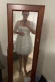 I bought this dress as a potential wedding reception dress. It does not look good on my hourglass body. I practiced dancing and jumping in it and the sleeves kept falling down which would definitely cause a wardrobe malfunction! :o - Jaclyn W.