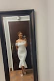 This dress was so beautiful. It hugs in all the right places and the material is real soft. The dress also comes with a built-in white slip to prevent seeing through the dress. The dress is very modest and appropriate and made me feel like the most beautiful bride. If you're thinking about getting it JUST DO IT!!! - Olivia G.