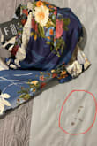 Weird fit. The right side was very loose on my chest and arm and the left side was very tight. It was as if the chest area and upper arm of the right side was an XL, and the chest and upper arm of the left was a Medium. The fabric is a cheap material that doesn't breathe. Also, when I took out the dress, there was dirt in the bag with the dress (see pic). So gross. - Josephine T.
