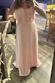 The zipper was broken and will not zip all the way up. The straps are very very thin. And the top half seems to have a lot of extra fabric on the sides. Making the top a little strange. Very long. - Shelby J.