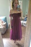 I absolutely love this dress! The color and fabric are wonderful. The top is stretchy and fits nicely with a strapless bra. Love! Can't wait to wear it to an upcoming wedding. - Megan C.