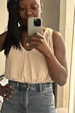 I don't have the longest torso. I would consider it average in fact, but I do have long legs. I usually don't have this issue with bodysuits that I purchase from American Eagle or Aerie. I had to play with this garment to lay the way that I wanted it to. Not to mention the fact that my bra peeks out a little bit more on one side versus the other. As for the price, I am disappointed. I'm not sending this one back as I have a previous bodysuit only because I intend to wear it with a jacket/blazer. - Synovia C.