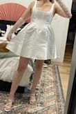 This dress makes me feel like a cupcake in all the right ways! It's cute, bridal, and I'm planning to wear it as a party dress during my wedding reception. I'm generally a size small in Lulus dresses, and a 4/6 in shirts/dresses, but the small was a bit tight. This is a corset though, and does the job it's supposed to do. Lots of support and coverage. My plan is to wear it a few times to stretch it out slightly so that it's a bit more comfortable. It was super difficult to zip over the waist where the skirt and corset meet, but my fiancé was eventually able to zip it up. - Melanie Y.