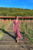 I purchased this for a trip to Tuscany, Italy. I wanted something cute but a little more conservative because of the culture there. This dress was perfect. Wore it wine tasting and driving through the hills of Tuscany. The wrap is easy to use and adjustable, the length is flattering and the slit makes it easy to walk in. I am 5'7" / 120lbs / 32D and purchased a Small. - Lisa C.