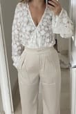Bought this top for my engagement drinks and love it. It is see through but goes well with a nude bra. Ordered a small and it fit perfectly. - Anna C.