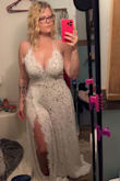 The dress is stunning and fits me right out of the box. For reference, I'm a consistent size 10 and have breast implants, and there is zero bust support to the dress. You'll need tape or something to keep things in place. The straps feel flimsy but they look like they'll hold up. I'm planning to do some minor alterations, as it's pretty long, but overall it's gorgeous, perfect, and everything I wanted. I do wish they had different shades of bodysuit to choose from as well - the one included is a little too dark, but I can work with it. The photo is pre-alterations, fresh out of the box. - Sherrie J.