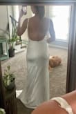 This dress fit like a glove. The material is a bit stretchy, shiny, and felt expensive. Loved the low back and the ability to lengthen or shorten the straps. - Shelby J.