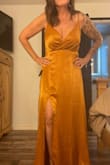 I ordered this dress in dark green, maroon, and rust to see which one I like best. They all fit amazing and the colors are gorgeous. I had a really hard time deciding which one. The material is like a heavy crushed satin and absolutely gorgeous. - Heather A.