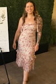 I looooooved the way this dress looked on me! I felt like such a 10!! It accentuated my curves in an understated, elegant way, but stayed flirty with the tie straps. The material is actually kind of silky and thin (plus it has a silky liner), so it wasn't too hot to wear to a rehearsal dinner on a warm California night. I highly recommend this dress. I wish I had more occasions to wear it! - Chyna M.