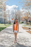 This dress was very comfortable and was perfect for sitting through a long graduation ceremony. It rode up when walking for longer periods but stayed down otherwise. The fit was true to size. - Julia K.
