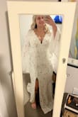 I actually bought another custom wedding dress first from a different site that was $400 and wasn't in love with it. I decided to order this dress but was nervous that it was too cheap for a wedding dress. I was wrong! I should've went with this dress to begin with! It is like boutique quality, and no one would have any idea it was under $200. The sleeves are beautiful. However, it is much longer than expected. It drags the floor on me quite a bit, but after some tailoring, it will be just fine. Also for the large chested girls, this is a great dress that is classy but still sexy. Just the right amount of cleavage. It is a very flattering fit, and it makes me feel so beautiful. Highly recommend!! - Brianna P.