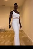 I bought this for an outdoor "summer chic" wedding reception. I loved the fit of the small on me. I originally ordered the medium, but it had a lot of room in the waist area. I did have to get it hemmed because it was a tad too long. Other than that, it fits perfectly. The fabric was soft. I wasn't hot. Definitely a show-stopper! - Aniesa K.