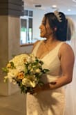 I was worried this dress would be too long. It was perfect with heels. I am breastfeeding and was able to wear a bra. I recommend a veil to hide the bra strap in the back. - Anahi V.