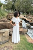 My daughter wore this to a dance and she looked so elegant. The fun open back gave extra pizazz to the dress! She received many compliments! It was long on her 5'5 frame and she has long legs. Even with a 2 inch heel we took off 5 inches at the bottom. Other than that it fit wonderfully. It was a bit see-through but she wore a beige bra and a beige slip and then it was perfect. - Mica M.