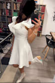 The quality of the dress is great, received many compliments. The ruffles at the top are easy to iron. The fit is true to size. - Andrea C.